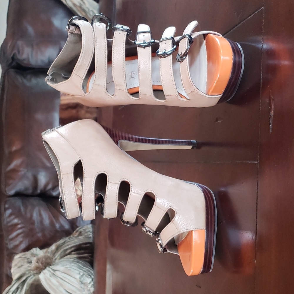 Platform tan booties with 6 buckle straps & a fun pop of orange under toes!